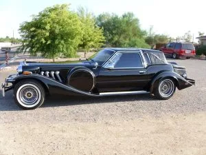 Classic black Zimmer car displayed at an estate sale hosted by C'z Estate Sales LLC.